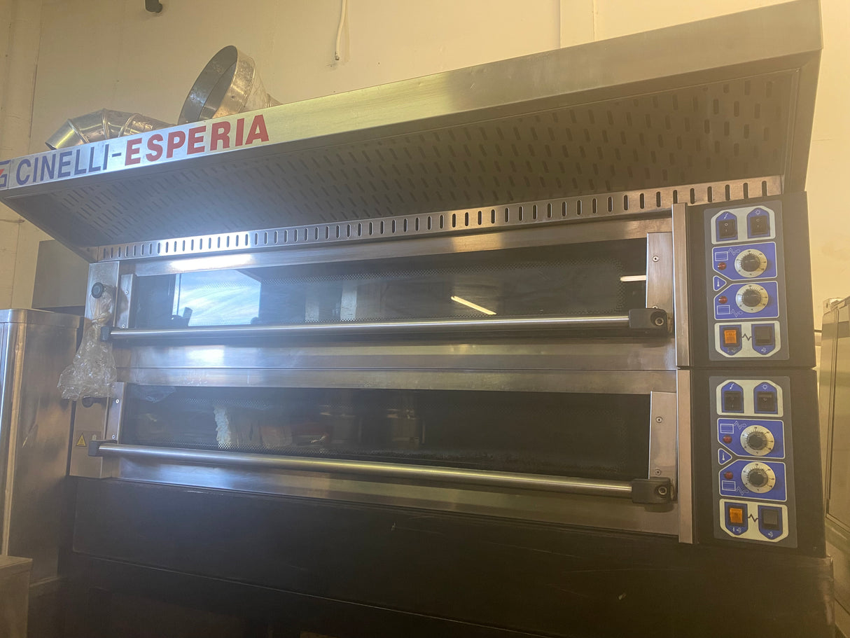 Commercial oven with 'Cinelli Esperia' branding in a kitchen setting