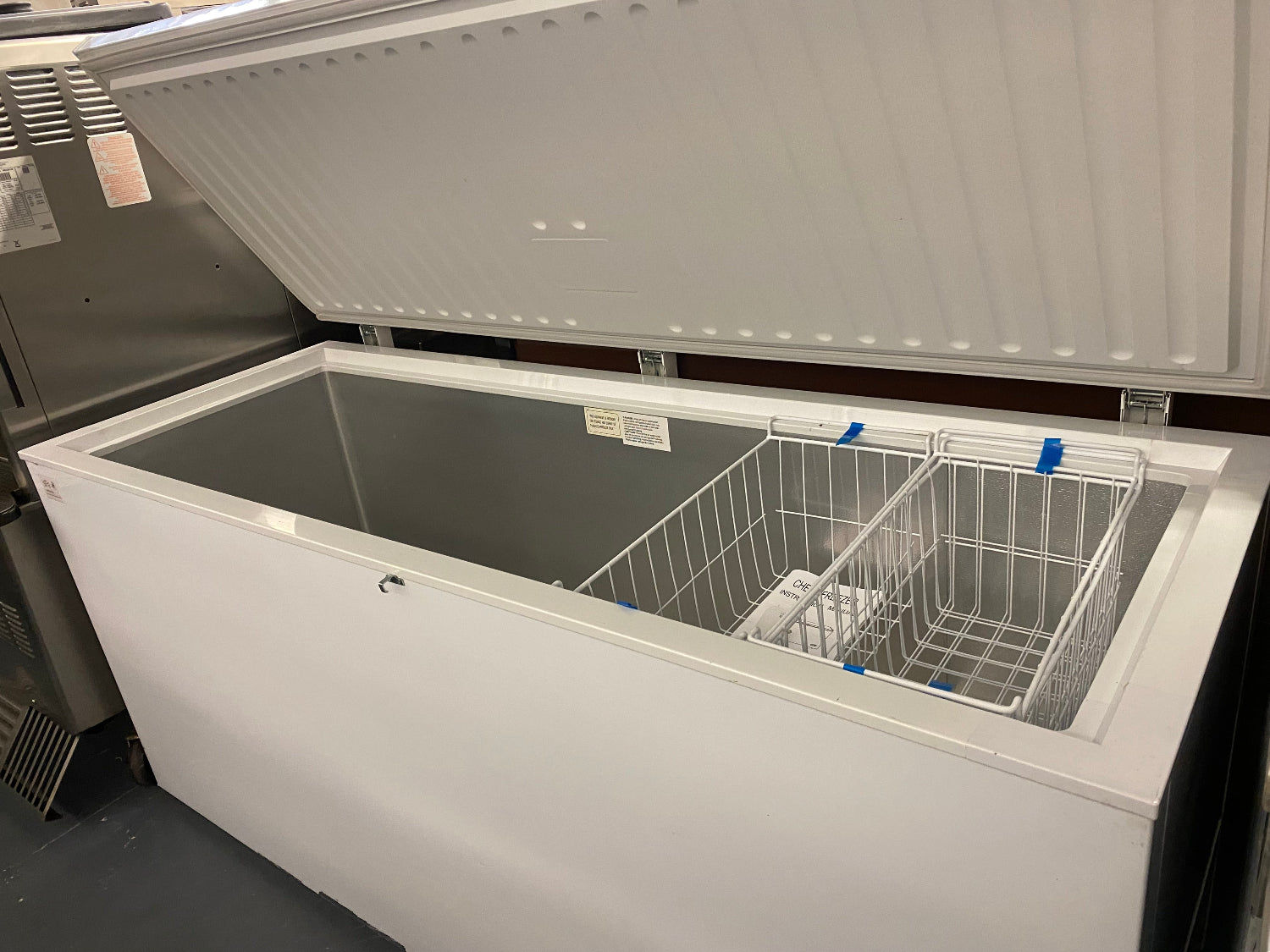White 72-inch commercial deep freezer with stay-open lid design